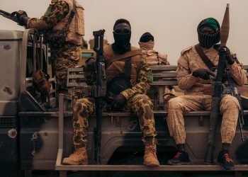 men in uniform attacking them