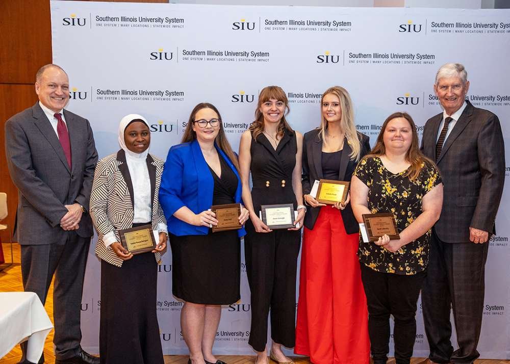 Distinguished Student Group photo (left to right: Mahony, Rasaq-Balogun, Park, Icenogle, Pruitt, Lukavsky, J Phil Gilbert, chair of the SIU Board of Trustees) SIUE Student portraits: Quinonez, Powell